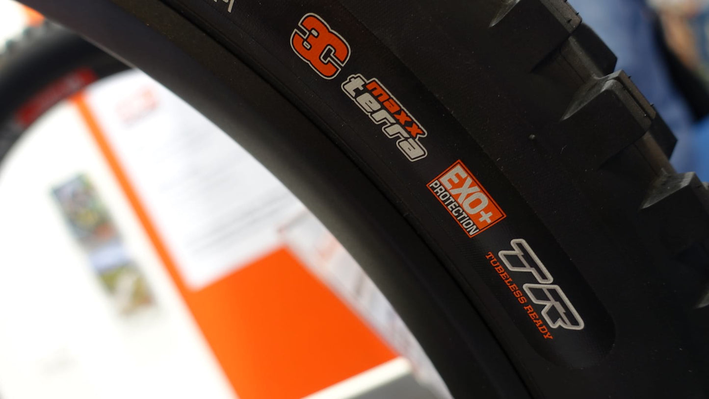 Close-up of a Maxxis Minion DHF 29 x 2.5" WT 3C MaxxTerra TR EXO+ mountain bike tire and tubeless ready labels.