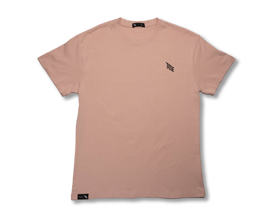 Title MTB Title Faded Midweight T-Shirt: light pink unisex tee, small black logo, natural dyes, black hem tag.
