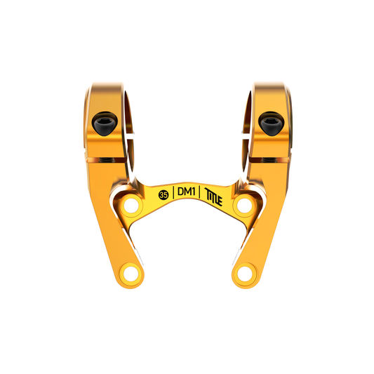 Title MTB DM1 35 Direct Mount Stem in gold with dual clamp mounts, black bolts, and “35 | DM1 | TITLE” on front.