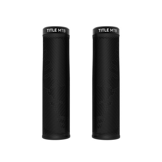 Two black Title MTB FORM Lock-On Grips with textured patterns, shown as durable grips on a white background.