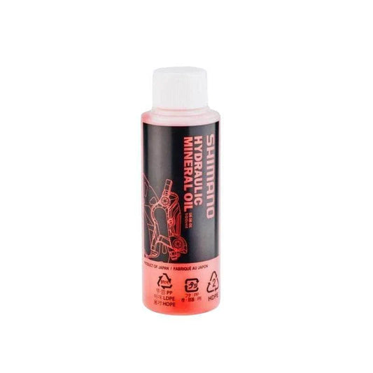 Shimano Hydraulic Mineral Oil (100ml) for disc brakes, with a black and red label and white screw cap.