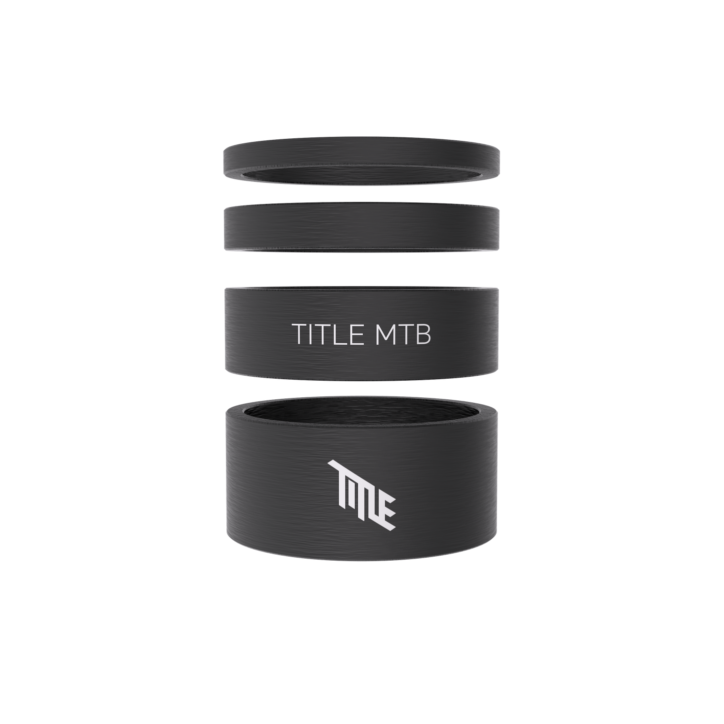 Title MTB Carbon Headset Spacer Kit: four black matte UD spacers, two with TITLE logos, shown stacked and separated.