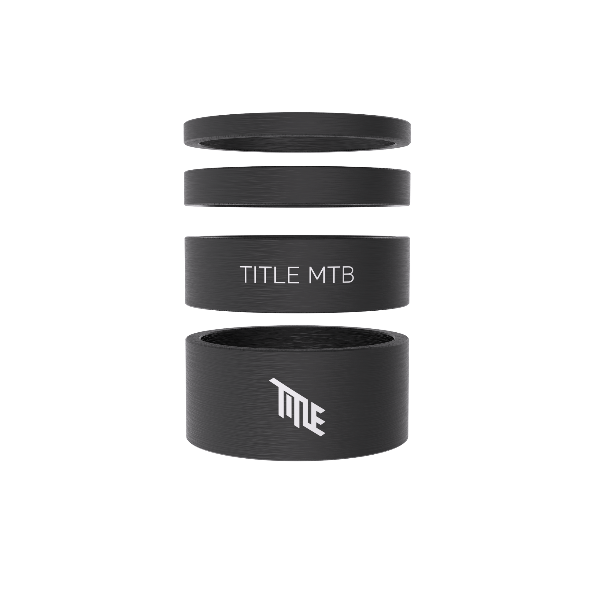 Title MTB Carbon Headset Spacer Kit: four black matte UD spacers, two with TITLE logos, shown stacked and separated.